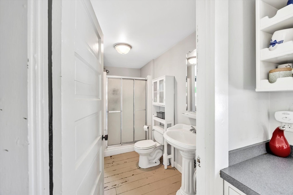 9 Jason Lane Harwich, MA 02646 - Photo 10 of 37 a bathroom with a toilet a sink and a mirror