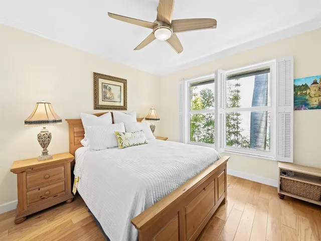 a bedroom with a large bed and a window