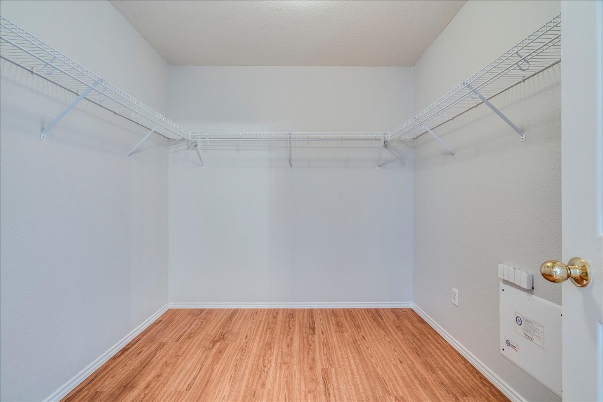 1507 Davis Mountain Loop Cedar Park, TX 78613 - Photo 17 of 30 Spacious closet featuring wood laminate flooring, and built-in wire shelving