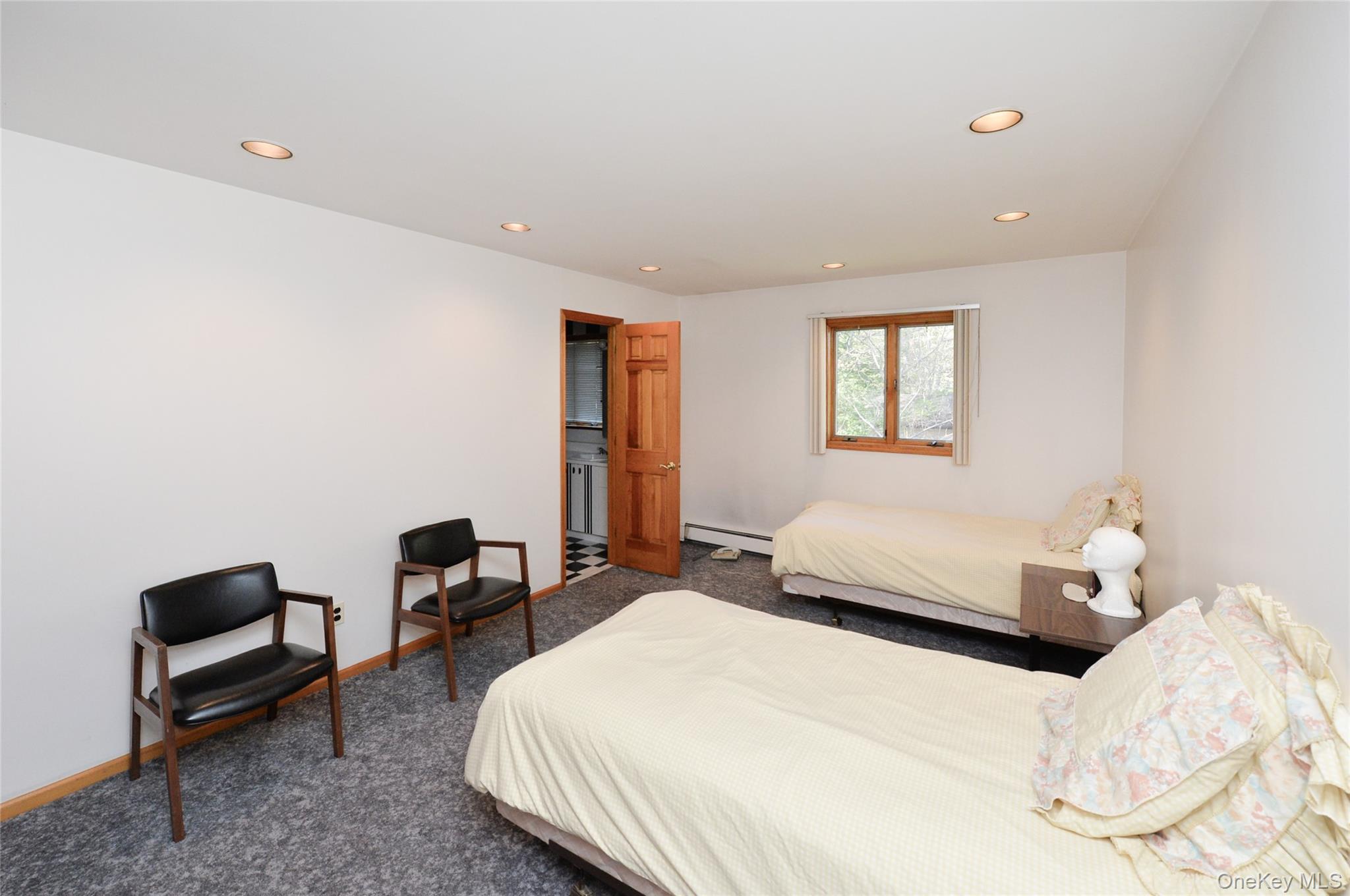 24 Highview Road Monsey, NY 10952 - Photo 29 of 44 a bedroom with a bed and a chair
