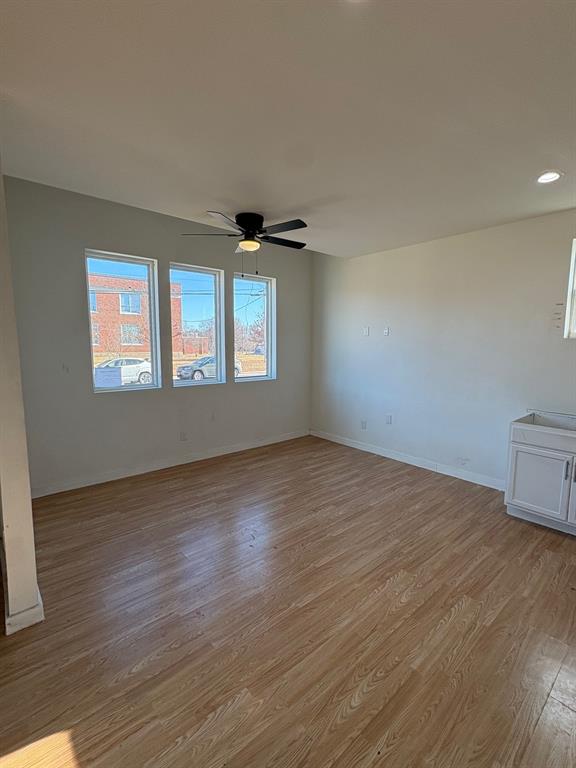 4209 Metropolitan Avenue Dallas, TX 75210 - Photo 2 of 16 a view of an empty room with wooden floor and window