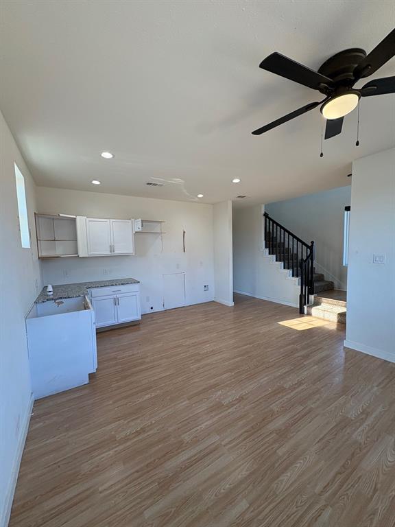 4209 Metropolitan Avenue Dallas, TX 75210 - Photo 3 of 16 a view of kitchen and empty room with wooden floor