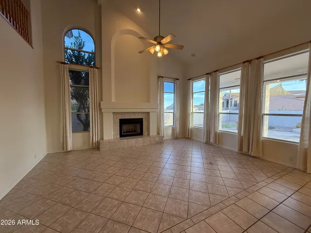 a view of livingroom with furniture and chandelier fan