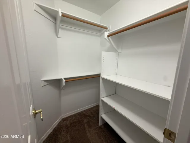 a view of an empty walk in closet