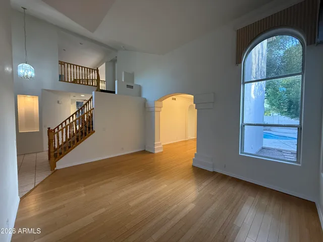 a view of an entryway with wooden floor