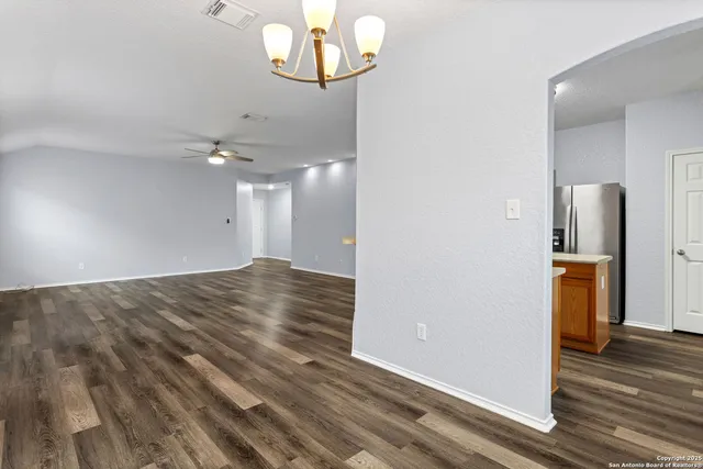 a kitchen with a refrigerator sink and stove