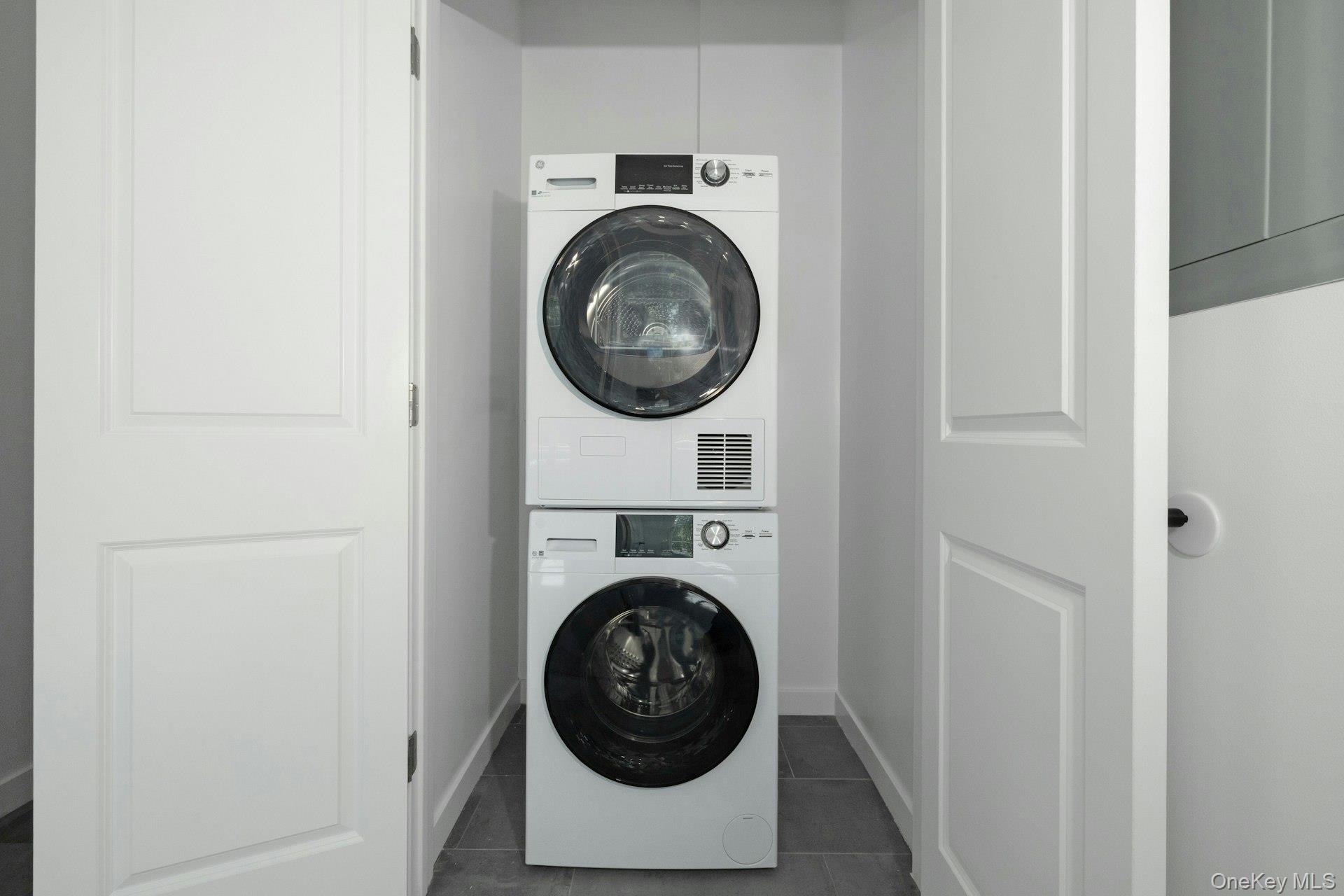 962 Rte 9W, Unit 106 Congers, NY 10920 - Photo 13 of 48 a view of washer and dryer in a utility room