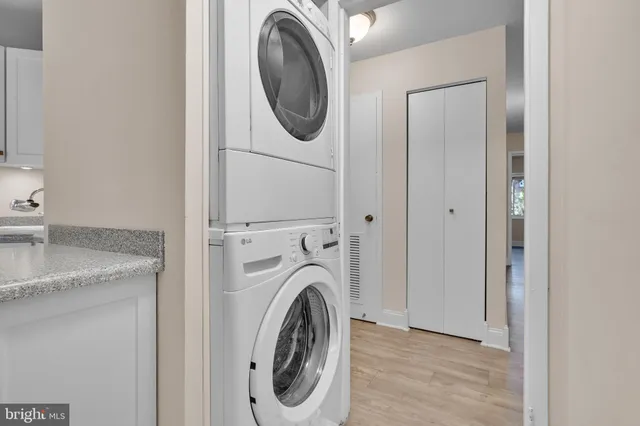 a view of a storage and utility room with washer and dryer