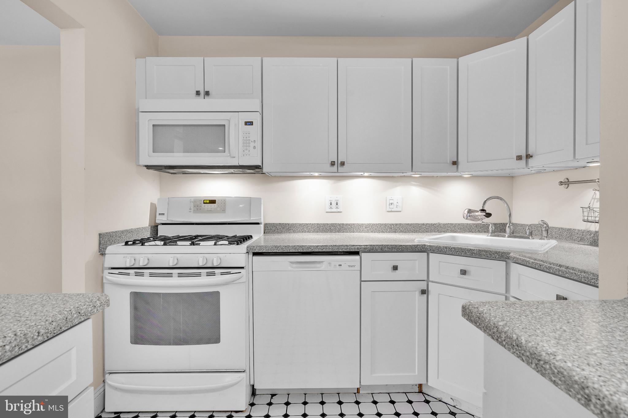 1439 Northgate Square, Unit 39/21B Reston, VA 20190 - Photo 15 of 23 a kitchen with cabinets appliances and a sink