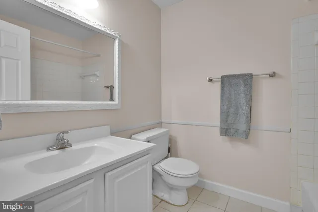 a bathroom with a sink toilet and vanity