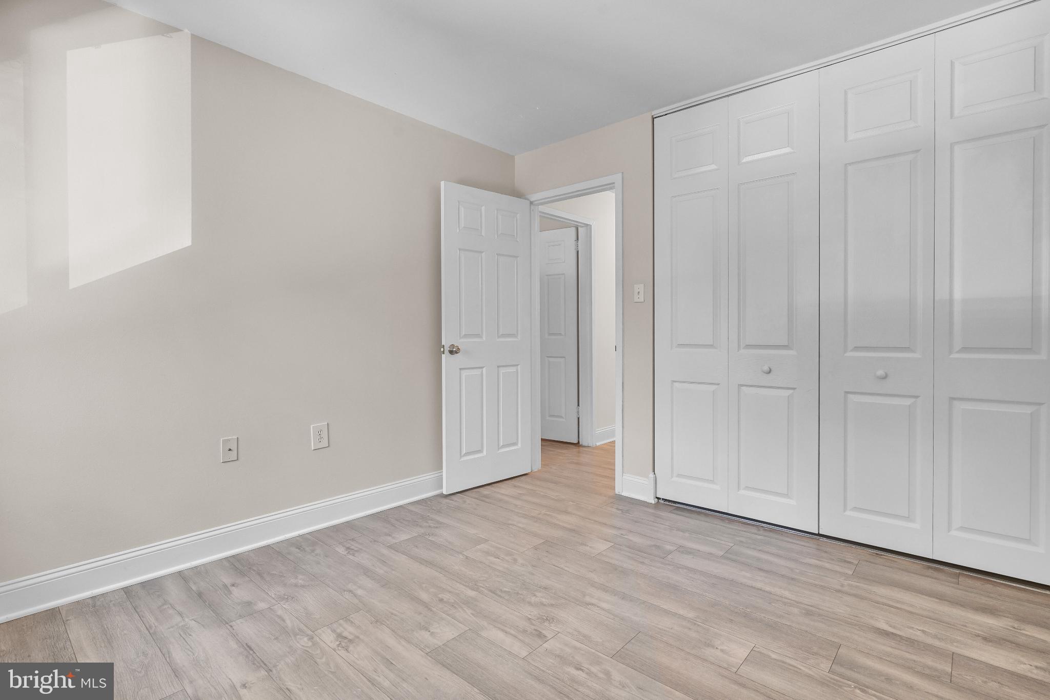 1439 Northgate Square, Unit 39/21B Reston, VA 20190 - Photo 21 of 23 a view of an empty room with wooden floor