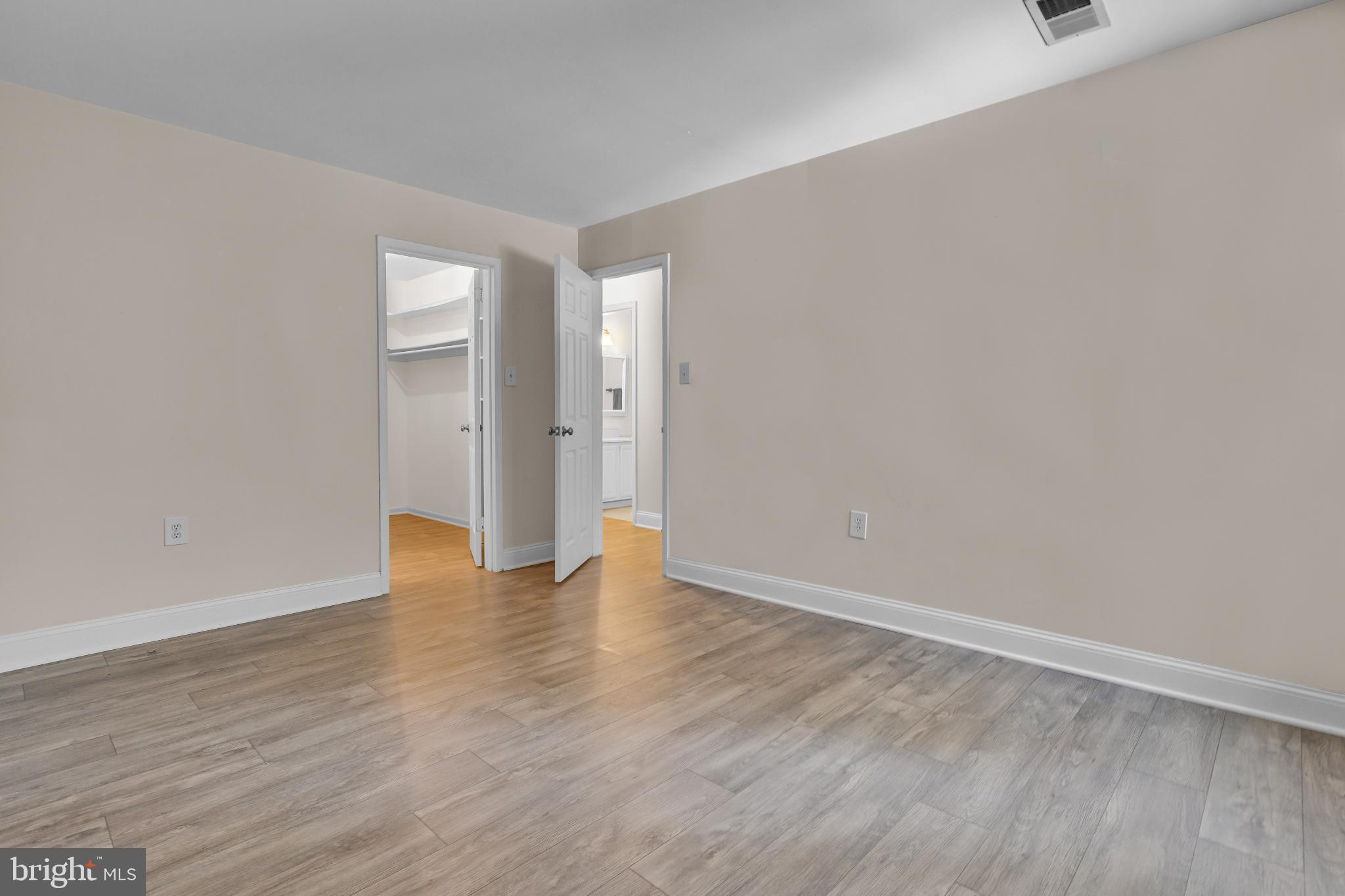 1439 Northgate Square, Unit 39/21B Reston, VA 20190 - Photo 22 of 23 a view of an empty room with wooden floor