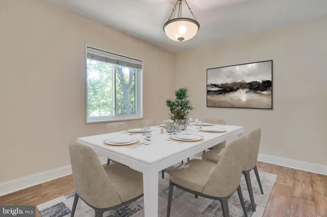 a dining room with furniture and window
