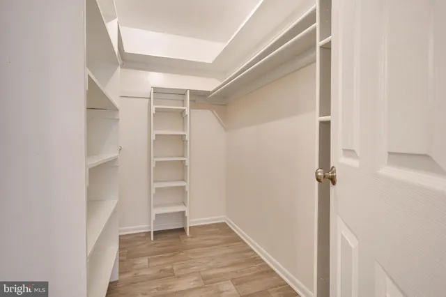 a view of an empty walk in closet