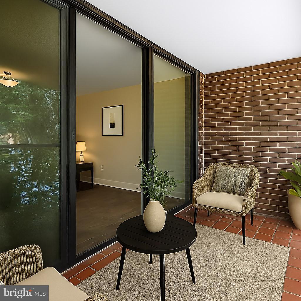 1439 Northgate Square, Unit 39/21B Reston, VA 20190 - Photo 8 of 23 a view of a balcony with chairs and a potted plant