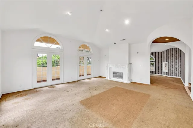 a bathroom with shower sink and glass door