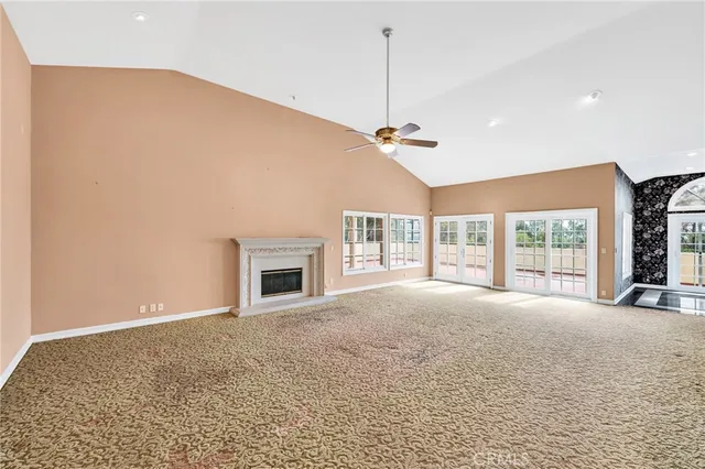 a view of a room with window and chandelier