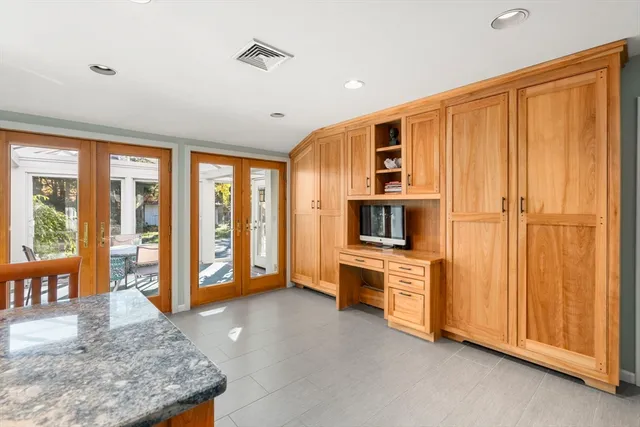 a dining room with furniture wooden floor and a rug