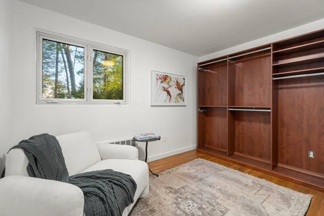 a bedroom with a bed and a desk