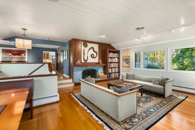 a living room with furniture and a fireplace