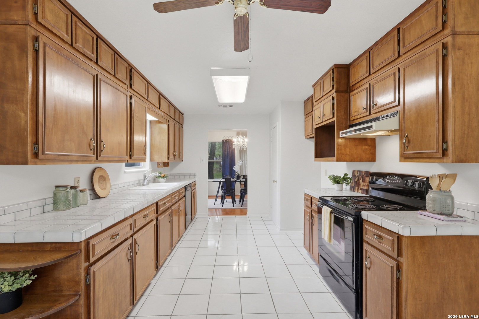 261 Fawn Lane Spring Branch, TX 78070 - Photo 13 of 44 a kitchen with stainless steel appliances a sink stove and cabinets