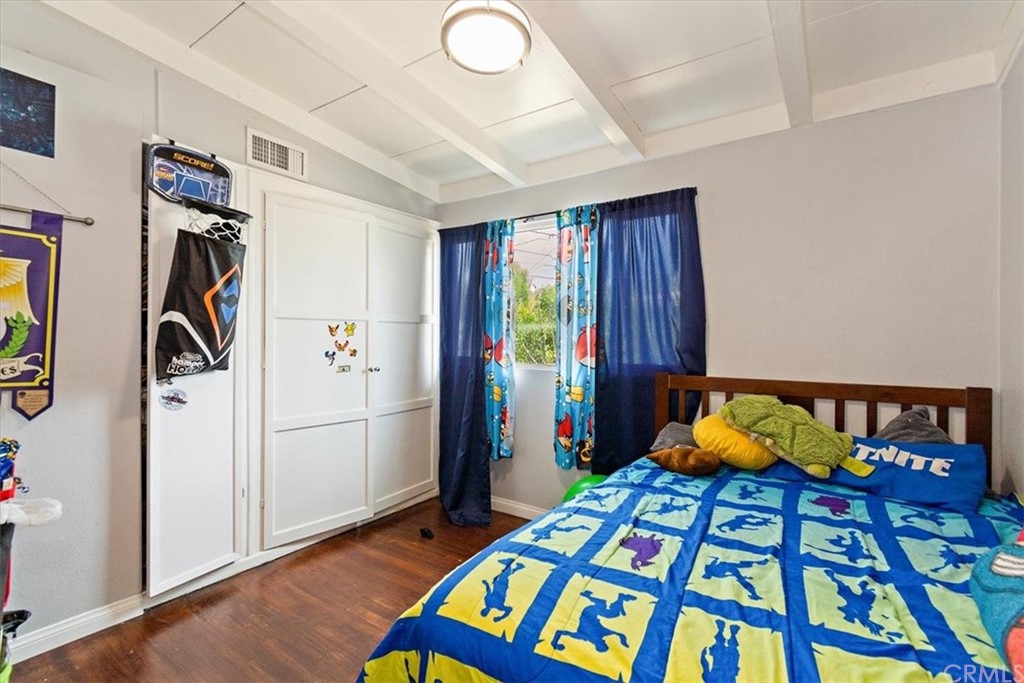 3510 McKenzie Street Riverside, CA 92503 - Photo 13 of 27 a bedroom with a bed and a window