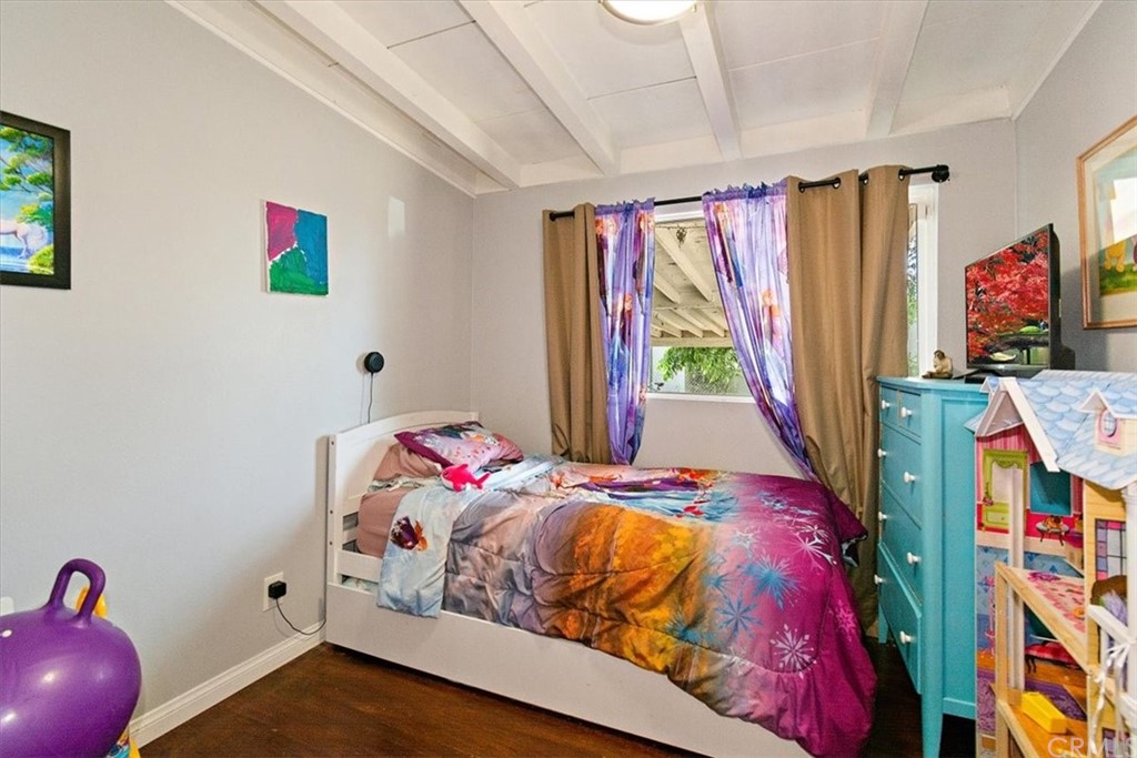 3510 McKenzie Street Riverside, CA 92503 - Photo 14 of 27 a bedroom with a bed and a window