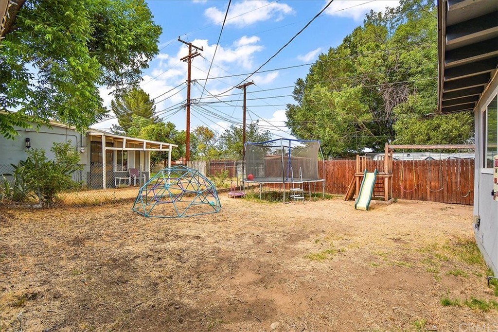3510 McKenzie Street Riverside, CA 92503 - Photo 25 of 27 a view of a house with a backyard and a patio