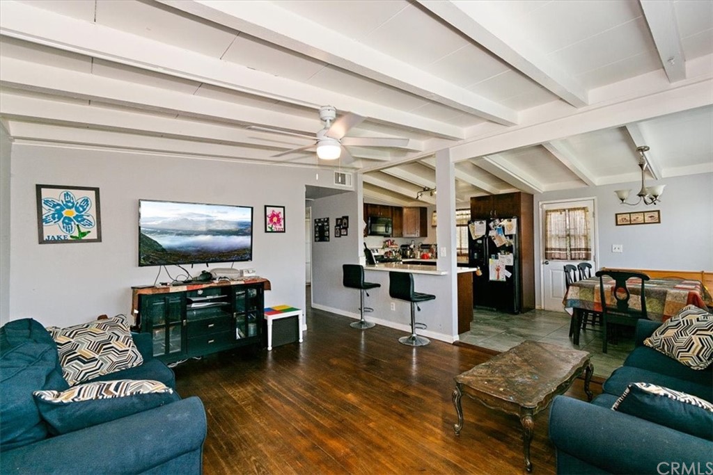 3510 McKenzie Street Riverside, CA 92503 - Photo 3 of 27 a living room with furniture and a flat screen tv