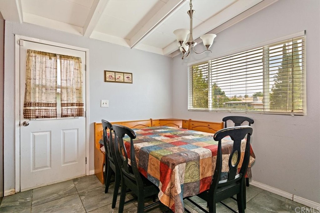 3510 McKenzie Street Riverside, CA 92503 - Photo 8 of 27 a bedroom that has a bed and a table in it