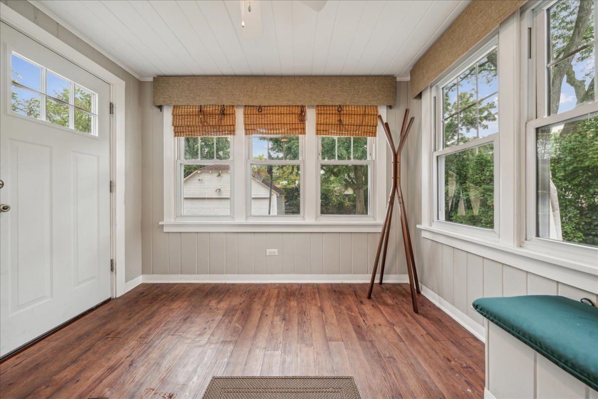 212 E Road Glen Ellyn, IL 60137 - Photo 18 of 42 a view of an empty room with wooden floor and a window