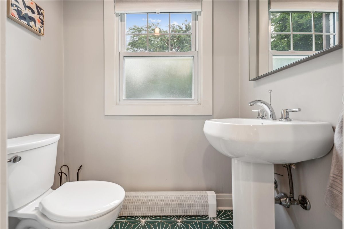 212 E Road Glen Ellyn, IL 60137 - Photo 19 of 42 a bathroom with a toilet a sink and a window