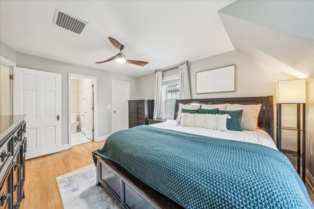 212 E Road Glen Ellyn, IL 60137 - Photo 21 of 42 a bedroom with a bed and a chandelier