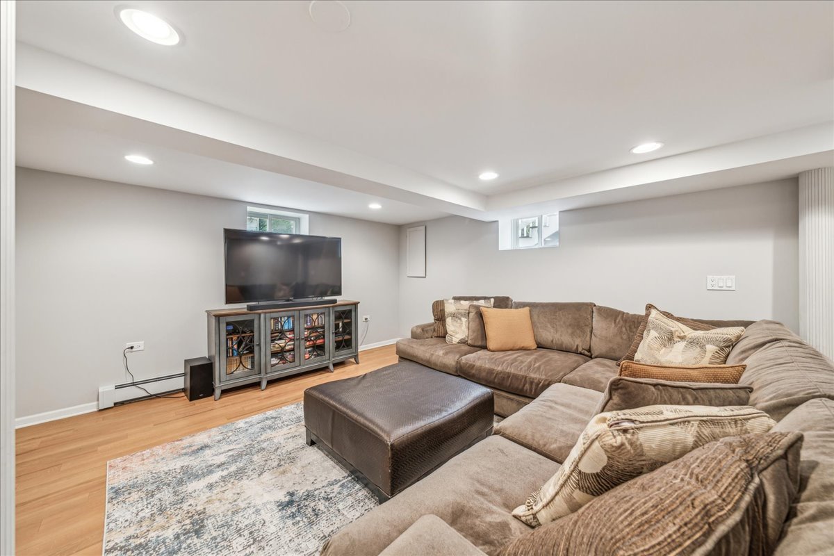 212 E Road Glen Ellyn, IL 60137 - Photo 27 of 42 a living room with furniture and a flat screen tv