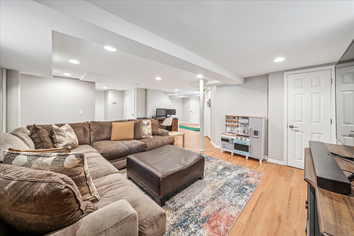 212 E Road Glen Ellyn, IL 60137 - Photo 28 of 42 a living room with furniture and a wooden floor