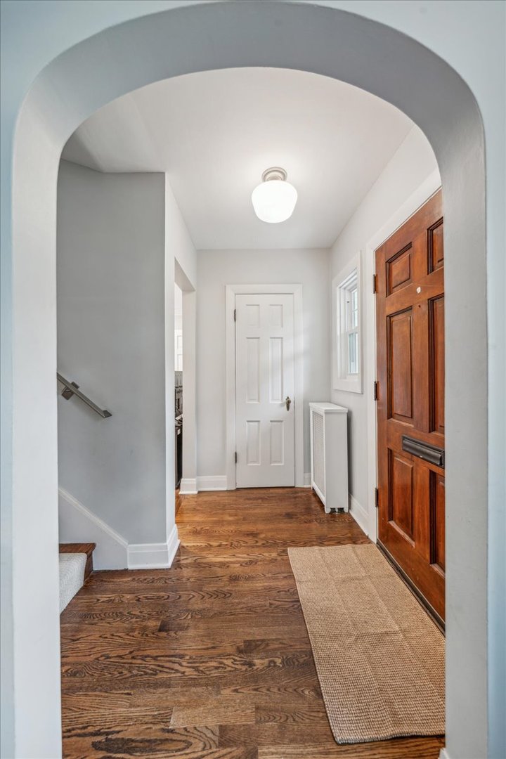 212 E Road Glen Ellyn, IL 60137 - Photo 3 of 42 a view of a livingroom with wooden floor and a kitchen space
