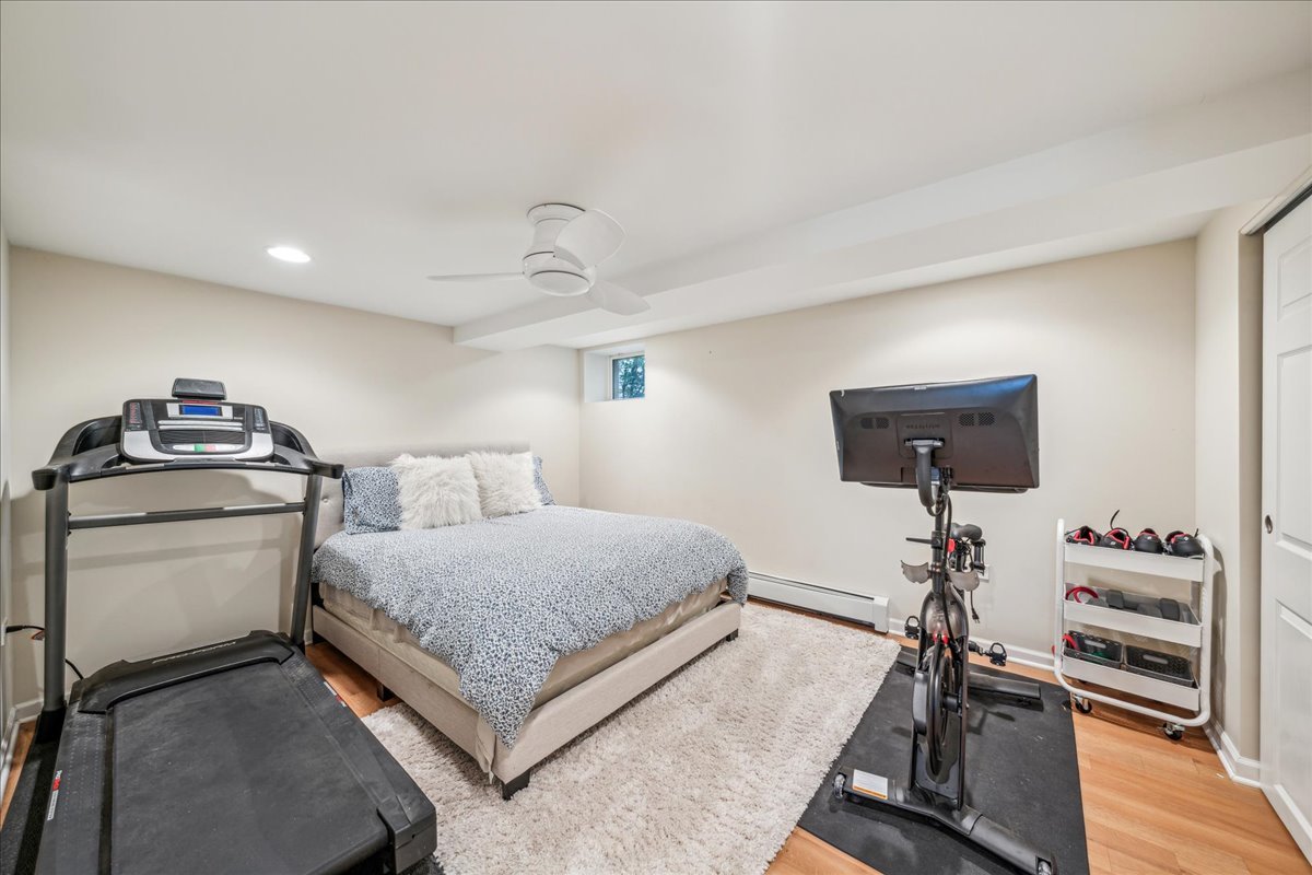 212 E Road Glen Ellyn, IL 60137 - Photo 31 of 42 a bedroom with a bed and a flat screen tv