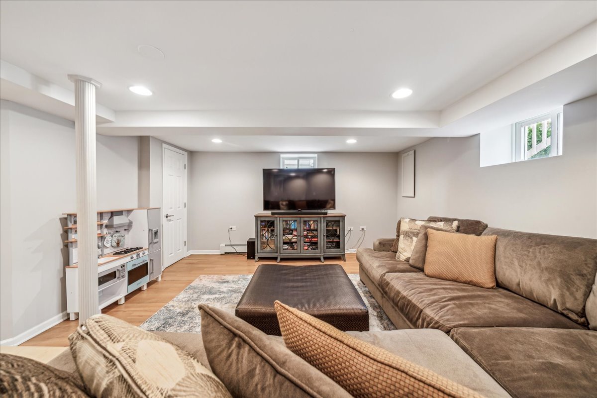 212 E Road Glen Ellyn, IL 60137 - Photo 32 of 42 a living room with furniture and a flat screen tv