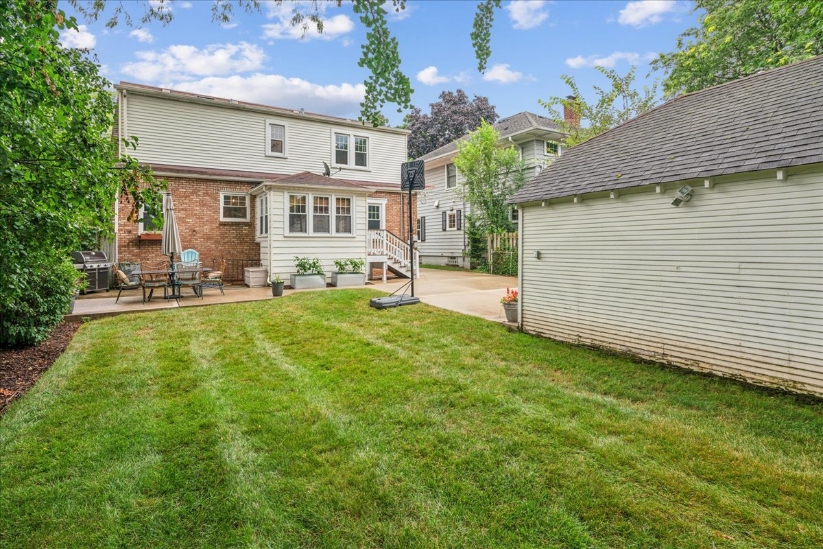 212 E Road Glen Ellyn, IL 60137 - Photo 34 of 42 a view of a house with a yard and sitting area