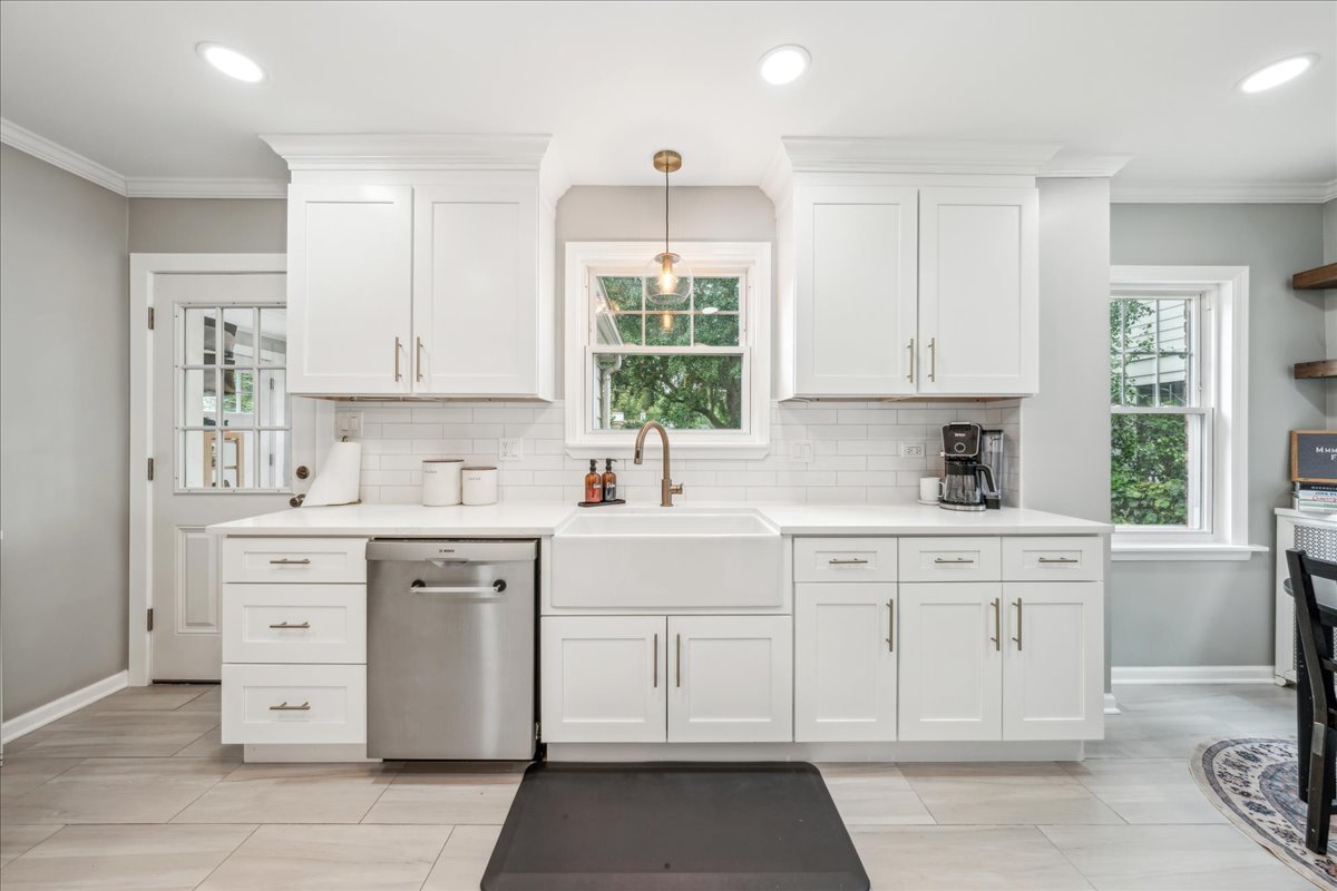 212 E Road Glen Ellyn, IL 60137 - Photo 4 of 42 a kitchen with white cabinets window and appliances
