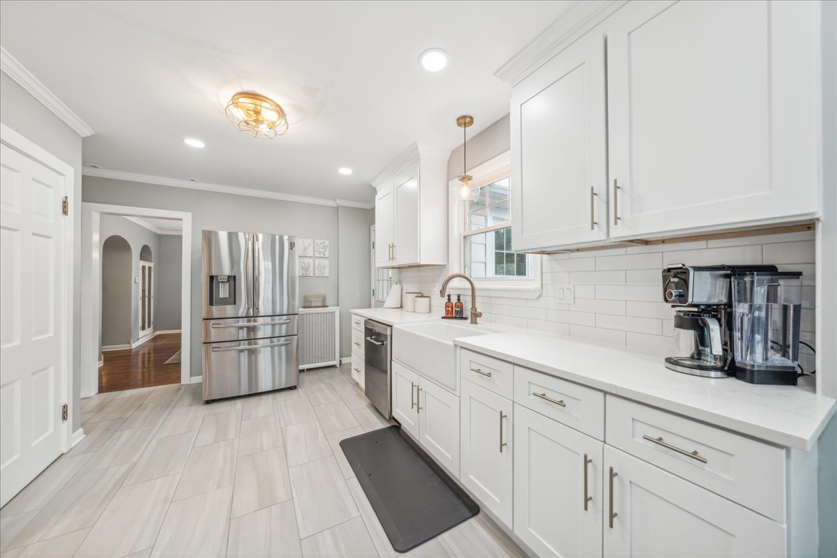 212 E Road Glen Ellyn, IL 60137 - Photo 7 of 42 a kitchen with white cabinets and refrigerator