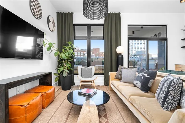 a view of living room with furniture and window
