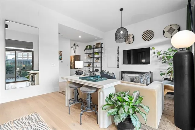 a view of a dining room kitchen with furniture and chandelier