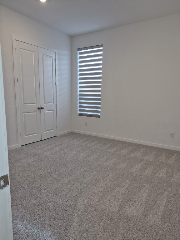 31007 Golden Felipe Street Fulshear, TX 77441 - Photo 13 of 19 a view of an empty room and a window