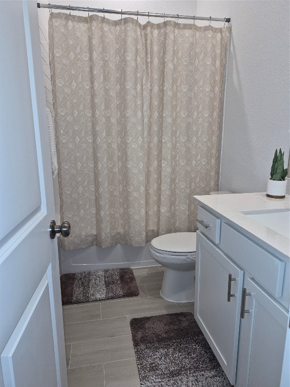 31007 Golden Felipe Street Fulshear, TX 77441 - Photo 14 of 19 a bathroom with a toilet a sink and curtain