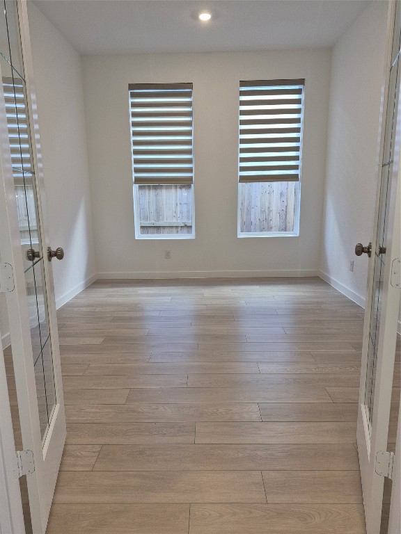 31007 Golden Felipe Street Fulshear, TX 77441 - Photo 15 of 19 a view of an empty room with a window