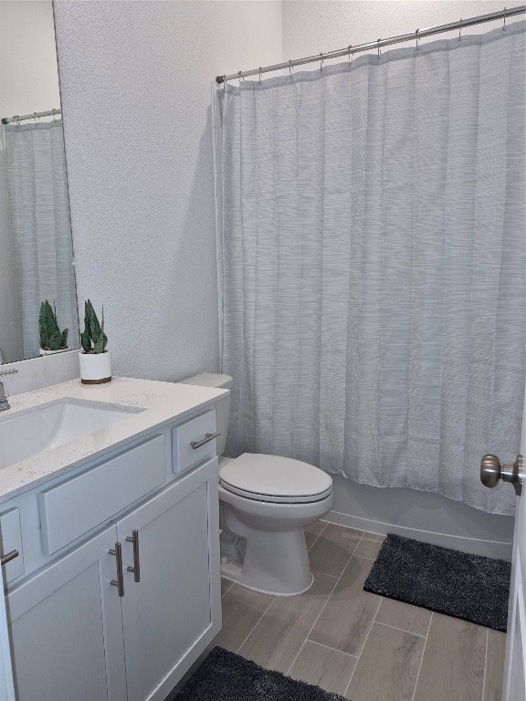 31007 Golden Felipe Street Fulshear, TX 77441 - Photo 16 of 19 a bathroom with a sink a toilet and shower curtain