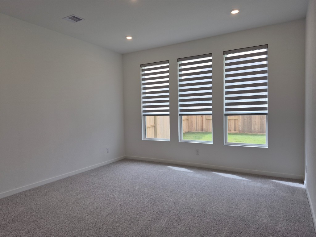 31007 Golden Felipe Street Fulshear, TX 77441 - Photo 10 of 19 a view of an empty room with a window