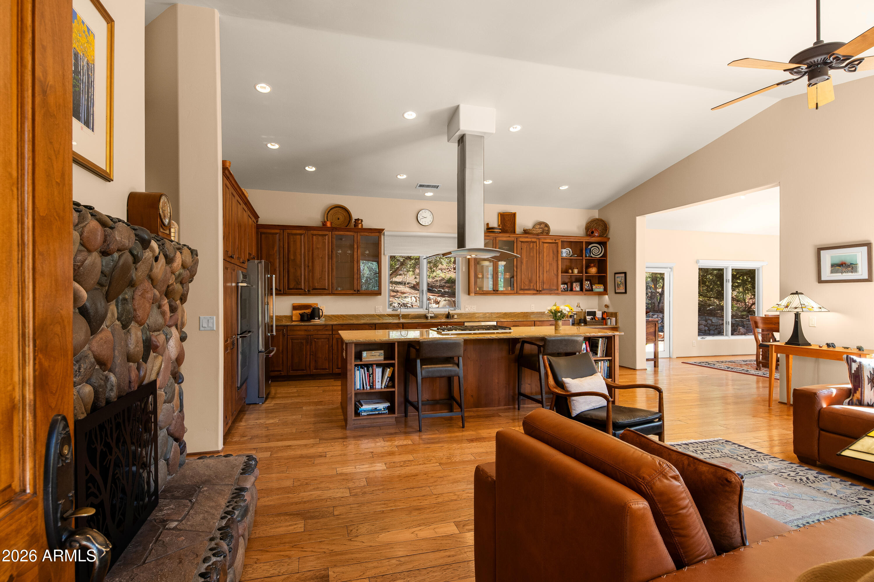 190 Morgan Road Sedona, AZ 86336 - Photo 22 of 51 a living room with furniture a rug kitchen view and a large window