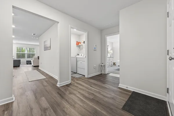a kitchen with stainless steel appliances granite countertop white cabinets and a stove